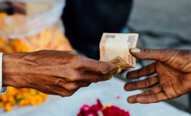 Photo by Adam Cohn / CC by-SA 2.0 Rupees Exchanging Hands