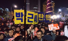 Photo reprinted courtesy of Teddy Cross via Flickr Mass protest in Cheonggye Plaza, by Teddy Cross