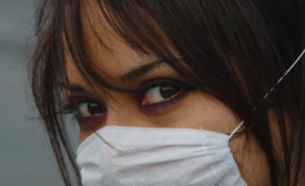 Photo reprinted courtesy Esparta Palma via Flickr Woman with mask