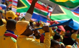 Photo reprinted courtesy Andrew Moore, via Flickr https://flic.kr/p/89KNj5 Fans at the 2010 FIFA World Cup in South Africa