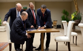 Photo courtesy USAFRICOM via Flickr Ben Rhodes stands next to President Barack Obama