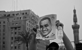 Photo reprinted courtesy Sarah.249, via Flickr A protestor in Tahrir Square, Cairo, holds up a portrait of former President Nasir, 2011