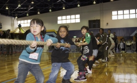 Photo reprinted courtesy Lance Cpl. Jennifer J. Pirante, via Wikimedia Commons Students play at the U.S.-Japan Friendship Exchange at the Marine Corps Air Station in Iwakuni, Japan