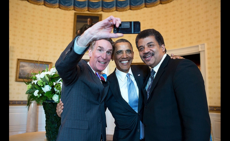Photo by The White House / CC by-SA 2.0 President Barack Obama poses for a selfie with Bill Nye, left, and Neil DeGrasse Tyson in the Blue Room prior to the White House Student Film Festival, Feb. 28, 2014.