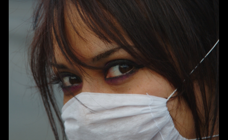 Photo reprinted courtesy Esparta Palma via Flickr Woman with mask
