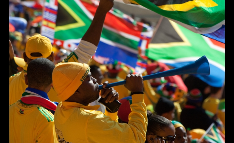 Photo reprinted courtesy Andrew Moore, via Flickr https://flic.kr/p/89KNj5 Fans at the 2010 FIFA World Cup in South Africa