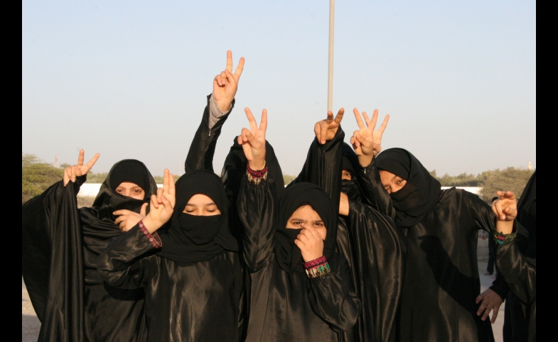 Photo reprinted courtesy Al Jazeera English, via Flickr https://flic.kr/p/9ieCZd Shia women protest the Sunni dictatorship in Bahrain