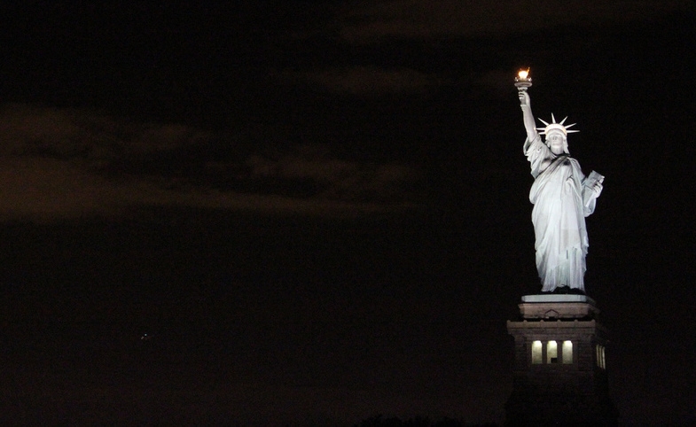 Photo reprinted courtesy Ana Paula Hirama via Flickr Statue of Liberty at Night