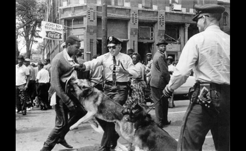 Photo reprinted courtesy Nasa-verve via Wikimedia Commons The iconic 1963 photo "Birmingham campaign dogs" by Bill Hudson, of the Associated Press