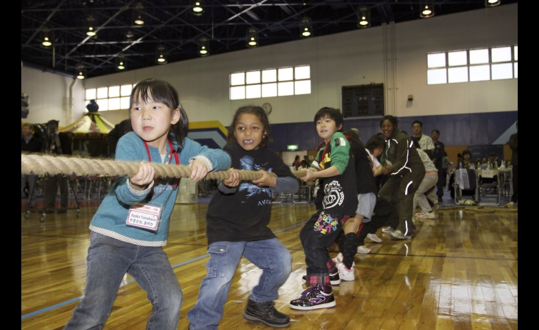 Photo reprinted courtesy Lance Cpl. Jennifer J. Pirante, via Wikimedia Commons Students play at the U.S.-Japan Friendship Exchange at the Marine Corps Air Station in Iwakuni, Japan